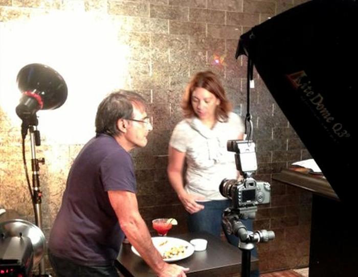 Cathy Longo directing a photo shoot on set